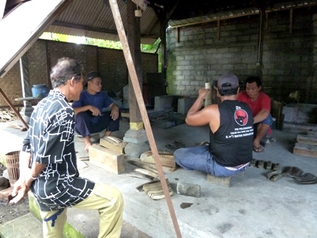 Men tuning metallophone keys at the gamelan foundry in Blahbatuh, Bali. Men tuning metallophone keys at the gamelan foundry in Blahbatuh, Bali.