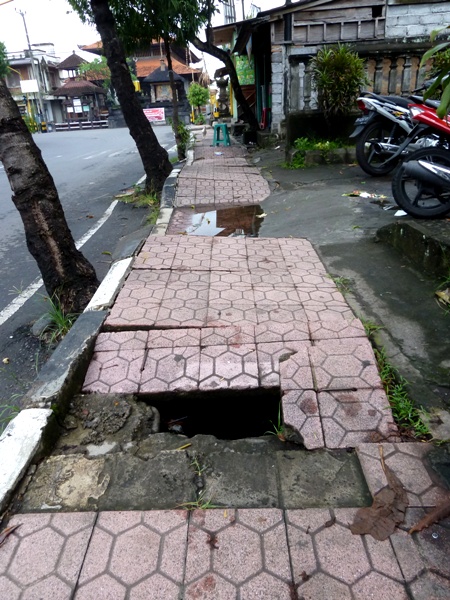 Just your average treacherous sidewalk in Peliatan, Bali. Just your average treacherous sidewalk in Peliatan, Bali.