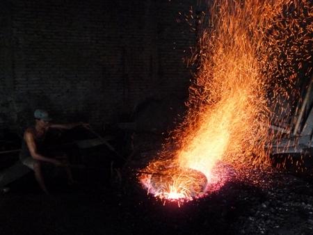 A worker raises hellfire and brimstone at the gamelan factory in Bekonang, Java. A worker raises hellfire and brimstone at the gamelan factory in Bekonang, Java.