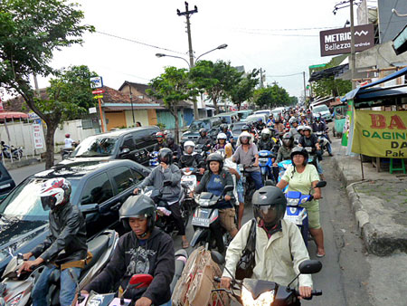 A standard pack of motorcycles in Solo, Java.