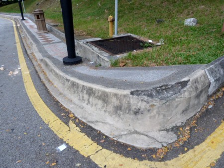 This sidewalk is so steep, you could easily drop in on it. Kuala Lumpur, Malaysia. This sidewalk is so steep, you could easily drop in on it. Kuala Lumpur, Malaysia.