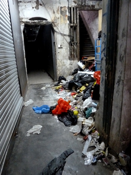 A big pile of random hallway trash right by my favorite alley food stall in Chinatown, Kuala Lumpur, Malaysia.