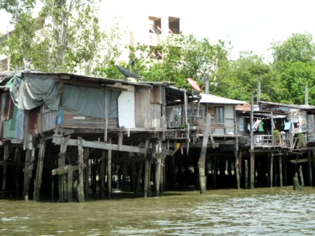 A standard shanty town on the Chao Phraya river in Bangkok, Thailand. A standard shanty town on the Chao Phraya river in Bangkok, Thailand.
