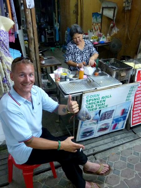 Thomas from Germany enjoys some grub at a food stall on Ko Phi Phi Don, Thailand.