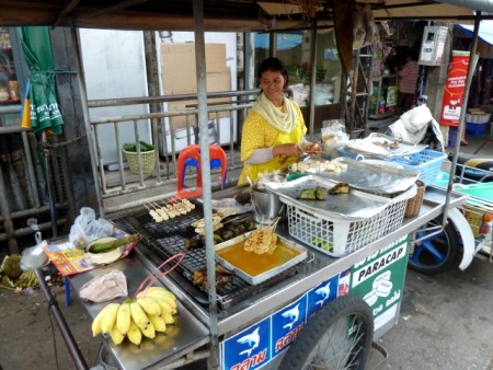 This lady sold me yummy fried bananas on a stick. Phuket Town, Thailand. This lady sold me yummy fried bananas on a stick. Phuket Town, Thailand.