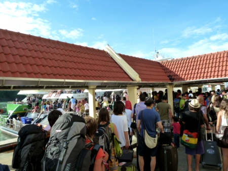 A mass of human cattle boards the ferry at Phuket Town, Thailand bound for the island of Ko Phi Phi Don.