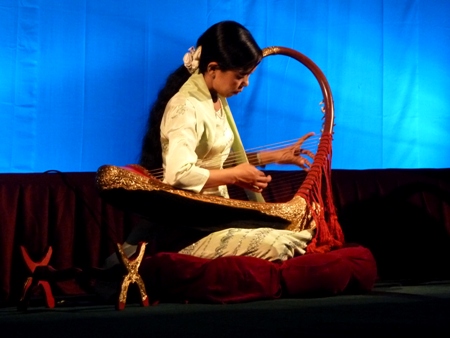 A solo harp performance at Mintha Theater in Mandalay, Myanmar. A solo harp performance at Mintha Theater in Mandalay, Myanmar.