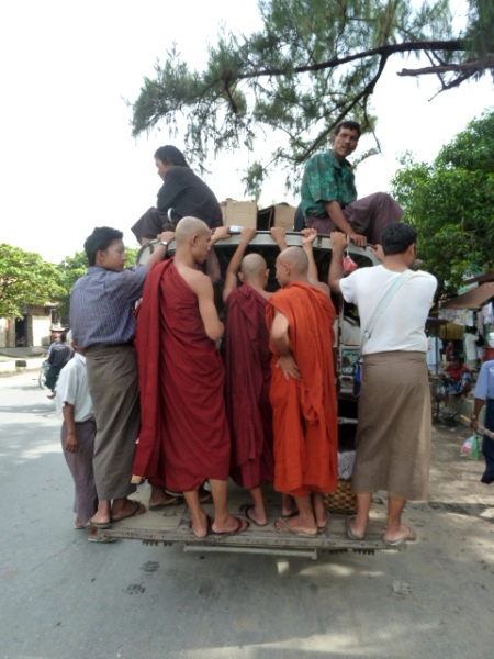 Buddhist monks on the go, take two, in Mandalay, Myanmar. Buddhist monks on the go, take two, in Mandalay, Myanmar.