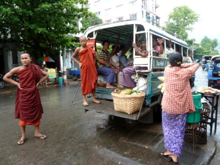 Buddhist monks on the go in Mandalay, Myanmar.