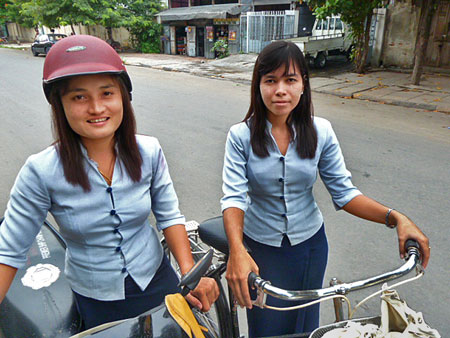 Two of the Royal Guest House girls head home after their shift in Mandalay, Myanmar.