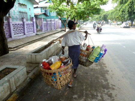The Bottle Man knows his way around town. Mandalay, Myanmar. The Bottle Man knows his way around town. Mandalay, Myanmar.