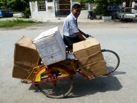 When fares dry up, trishaw drivers resort to the transport of goods. Mandalay, Myanmar. When fares dry up, trishaw drivers resort to the transport of goods. Mandalay, Myanmar.