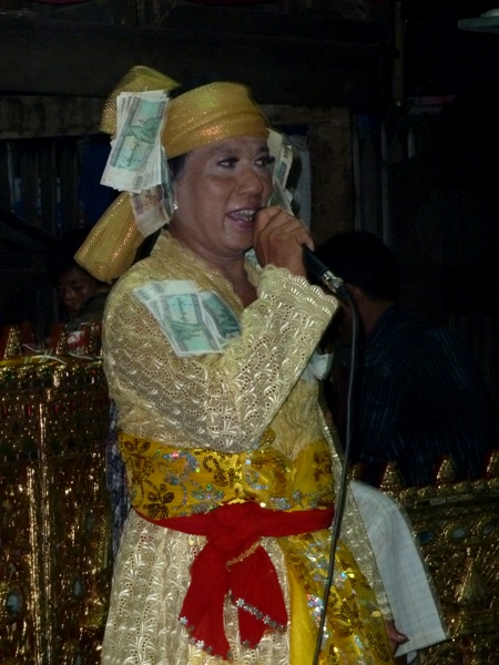 A nat kadaw commands the mic at the nat pwe in Taungbyone, Myanmar. A nat kadaw commands the mic at the nat pwe in Taungbyone, Myanmar.