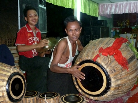 A cymbal player and a drummer beat time and increase the heat at the nat pwe in Taungbyone, Myanmar. A cymbal player and a drummer beat time and increase the heat at the nat pwe in Taungbyone, Myanmar.