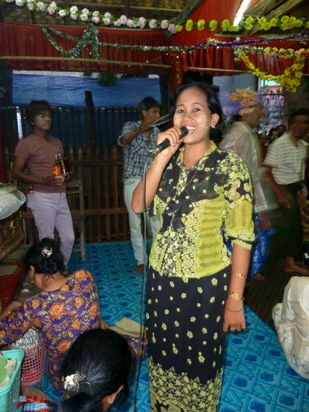 A singer gives me a big smile during the nat pwe in Taungbyone, Myanmar. A singer gives me a big smile during the nat pwe in Taungbyone, Myanmar.
