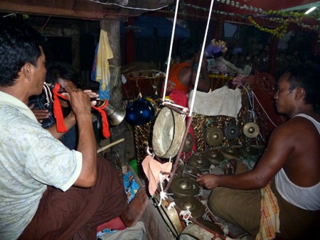 A hne and kyi waing player get on with it at the nat pwe in Taungbyone, Myanmar. A hne and kyi waing player get on with it at the nat pwe in Taungbyone, Myanmar.