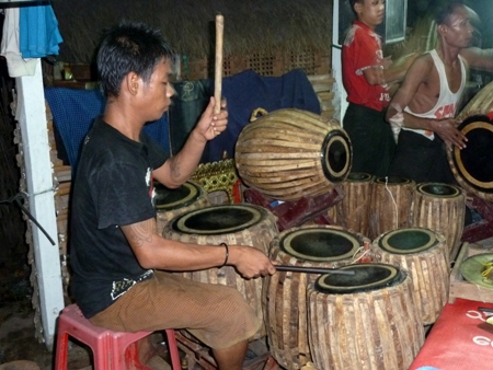 A chauk lone bat drummer wails the night away at the nat pwe in Taungbyone, Myanmar. A chauk lone bat drummer wails the night away at the nat pwe in Taungbyone, Myanmar.