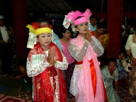 Two nat kadaws perform services at the nat pwe in Taungbyone, Myanmar. Two nat kadaws perform services at the nat pwe in Taungbyone, Myanmar.