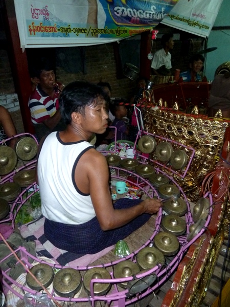 A kyi waing player commands the ring of fire at the nat pwe in Taungbyone, Myanmar A kyi waing player commands the ring of fire at the nat pwe in Taungbyone, Myanmar.