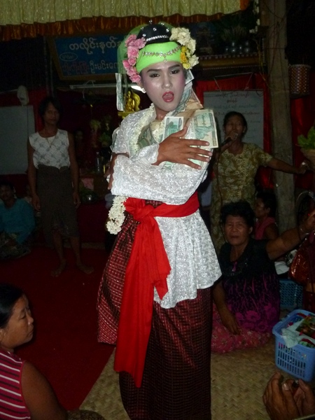 A nat kadaw mugs it up for my lens at the nat pwe in Taungbyone, Myanmar. A nat kadaw mugs it up for my lens at the nat pwe in Taungbyone, Myanmar.