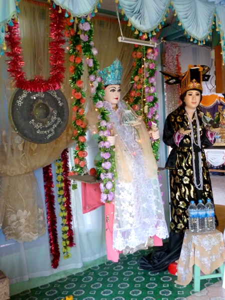 Two nats show off their fluffy finery at the nat pwe in Taungbyone, Myanmar. Two nats show off their fluffy finery at the nat pwe in Taungbyone, Myanmar.