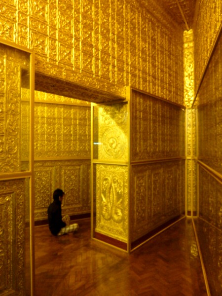 All gold, all the time! Meditating youth in the pizza slice-shaped chambers at Botataung Pagoda in Yangon, Myanmar. All gold, all the time! Meditating youth in the pizza slice-shaped chambers at Botataung Pagoda in Yangon, Myanmar.