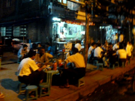 Yangon, Myanmar: A fine place for grown men to sit on tiny plastic chairs and tables designed for midgets.