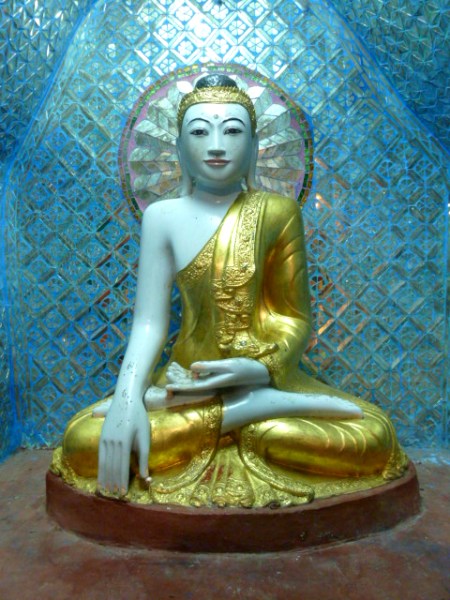 A radiant Buddha image at the Shwedagon Pagoda in Yangon, Myanmar.