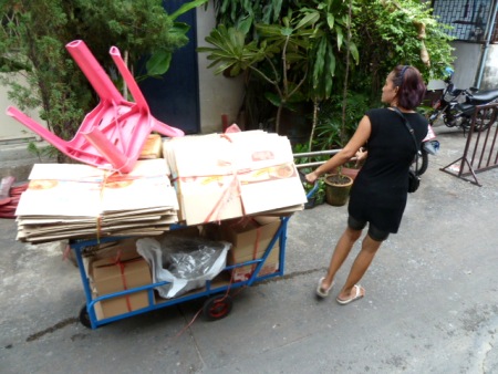 A cardboard cartist plies the back alleys of Banglamphu, Bangkok, Thailand. A cardboard cartist plies the back alleys of Banglamphu, Bangkok, Thailand.