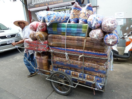 The rarely sighted mattress cart makes its rounds in Banglamphu, Bangkok, Thailand. The rarely sighted mattress cart makes its rounds in Banglamphu, Bangkok, Thailand.