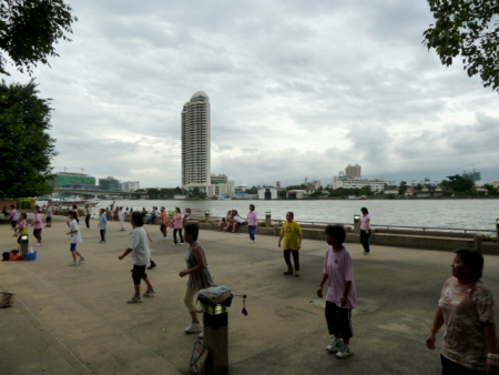 A late evening aerobics session steams full ahead at Santichaiprakan Park in front of the Chao Phraya river. Banglamphu, Bangkok, Thailand. A late evening aerobics session steams full ahead at Santichaiprakan Park in front of the Chao Phraya river. Banglamphu, Bangkok, Thailand.