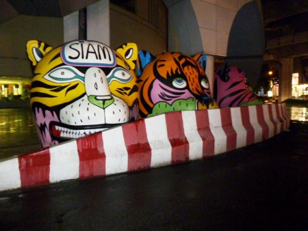 Watch out, or you'll get mugged by some big, funny cartoon characters at Siam Square in Bangkok, Thailand. Watch out, or you'll get mugged by some big, funny cartoon characters at Siam Square in Bangkok, Thailand.
