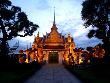 Dramatic lighting prevails in the evening at Wat Arun in Bangkok, Thailand. Dramatic lighting prevails in the evening at Wat Arun in Bangkok, Thailand.