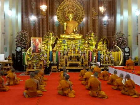 Buddhist monks sing during a prayer service at Wat Chana Songkhram in Banglamphu, Bangkok, Thailand. Buddhist monks sing during a prayer service at Wat Chana Songkhram in Banglamphu, Bangkok, Thailand.