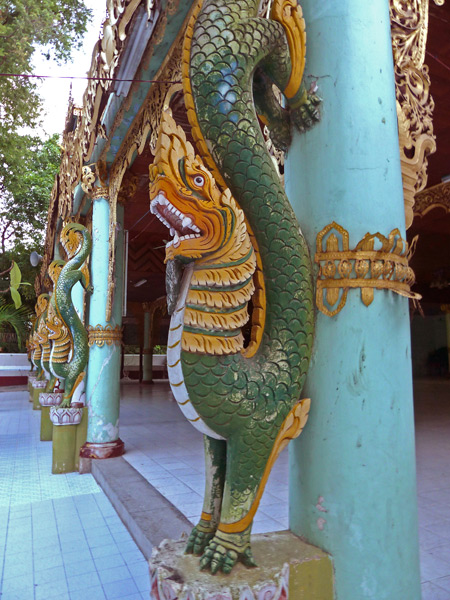 Fierce dragons guard a temple at Shwekyimyint in Mandalay, Myanmar.