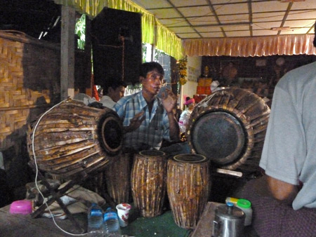 A drummer performs at the Nat Pwe in Taungbyone, Myanmar.