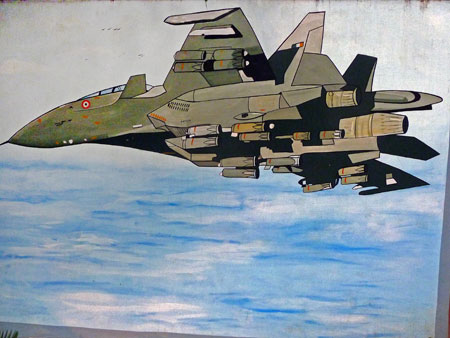 A tweaked painting of a fighter jet on a wall on Copernicus Marg in Central Delhi, India.