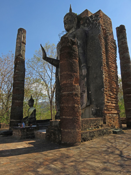 Two Buddha images at Wat Saphan Hin in Sukothai, Thailand.