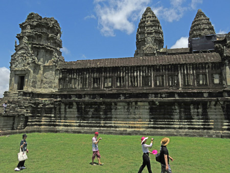 Visitors stroll around Angkor Wat in Siem Reap, Cambodia.
