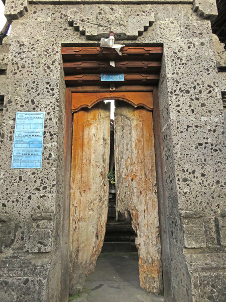 A well-worn family compound door on Jalon Kajeng in Ubud, Bali, Indonesia.