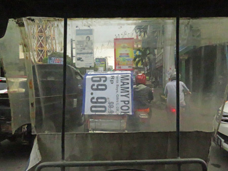 Looking out the front window of a becak in Medan, Sumatra, Indonesia.