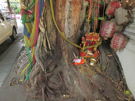 A Buddhist tree shrine on Thanon Phra Sumen in Banglamphu, Bangkok, Thailand.