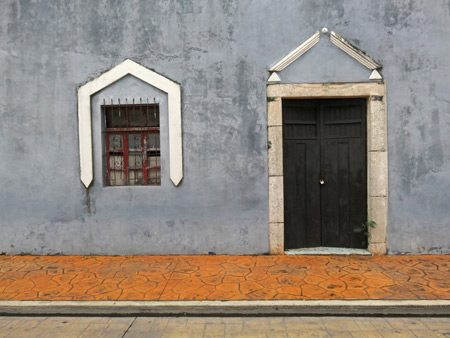 A decorated door and window in Valladolid, Mexico.
