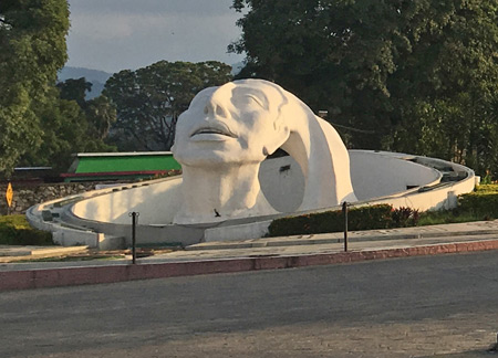 The huge Mayan bust in the roundabout in Palenque, Mexico.