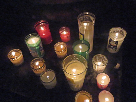 A collection of candles inside the Catedral de Nuestra Señora De La Asunción in Oaxaca City, Mexico.