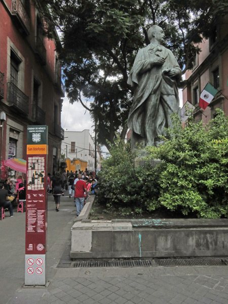 I saw the shifty guy near this statue (shown the next day) at the corner of San Ildefonso and Calle del Carmen in Mexico City, Mexico.