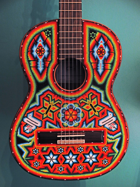 Dos Mariposas en Vuelo (an acoustic guitar covered with psychedelic beads) by Anselmo Hernandez Robles at the Museo de Arte Popular in Mexico City, Mexico.