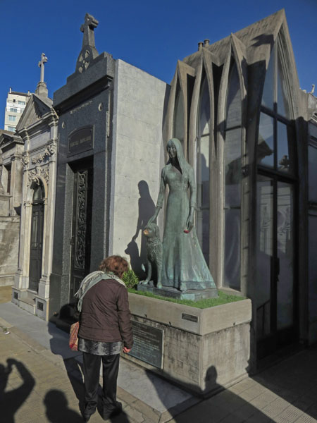 A statue of a woman with a puppy at the Cementerio de la Recoleta in Buenos Aires, Argentina.