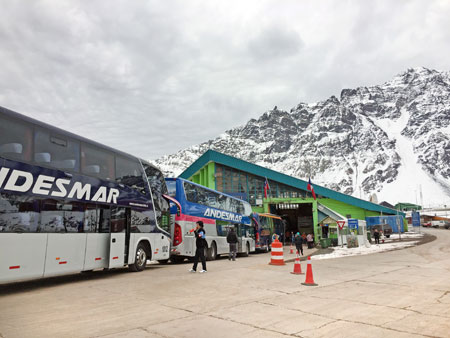 Andesmar buses at the immigration checkpoint in the Andes mountains on the border between Argentina and Chile.