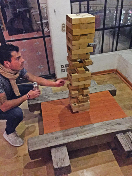 Playing Jenga at the Hostel Plaza de Armas in Santiago, Chile.